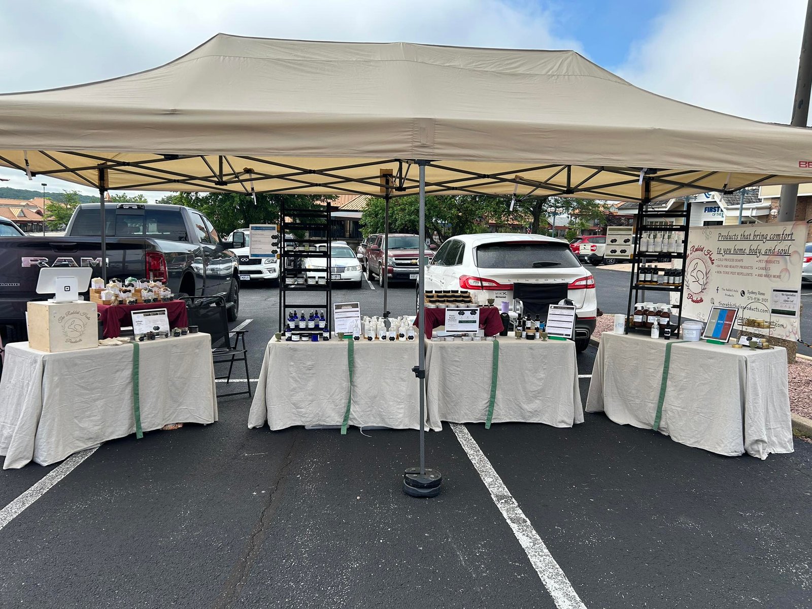 Rabbit Hole Products farmers market booth with handmade alpha-gal safe soap and body care