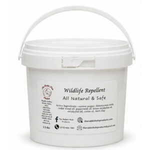 Natural wildlife repellent 2.5 lb bucket by Rabbit Hole Products on wood surface